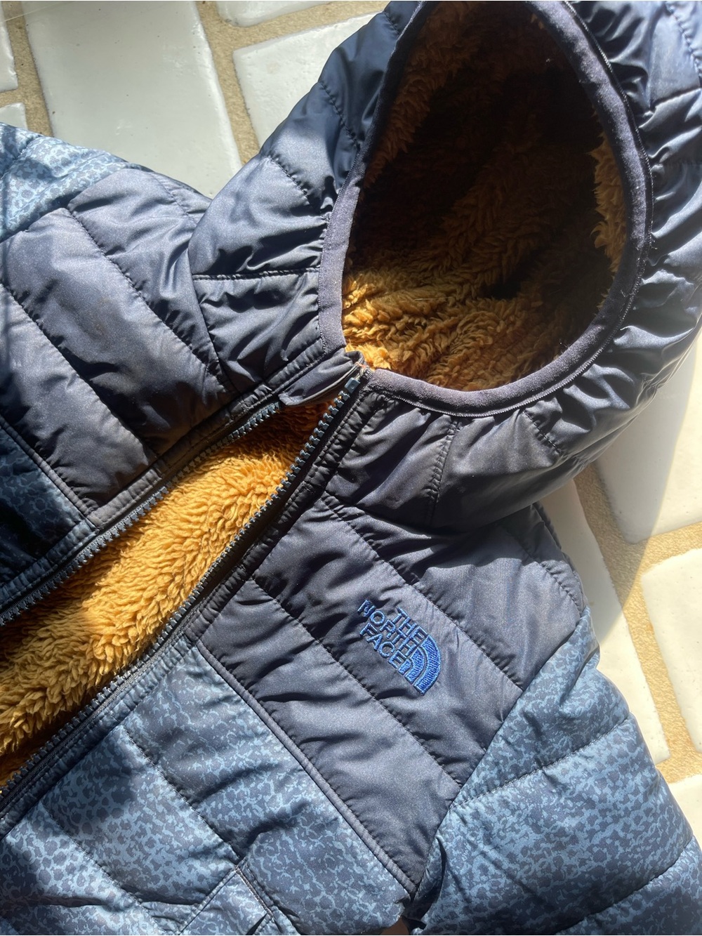 The North Face Navy Kids Puffer Jacket with Tan Sherpa Lining REVERSIBLE